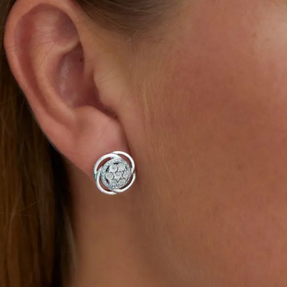 Sterling Silver Bright Cut Diamond Swirl Stud Earrings - 0.10 ctw